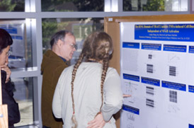 Two people looking at a research poster