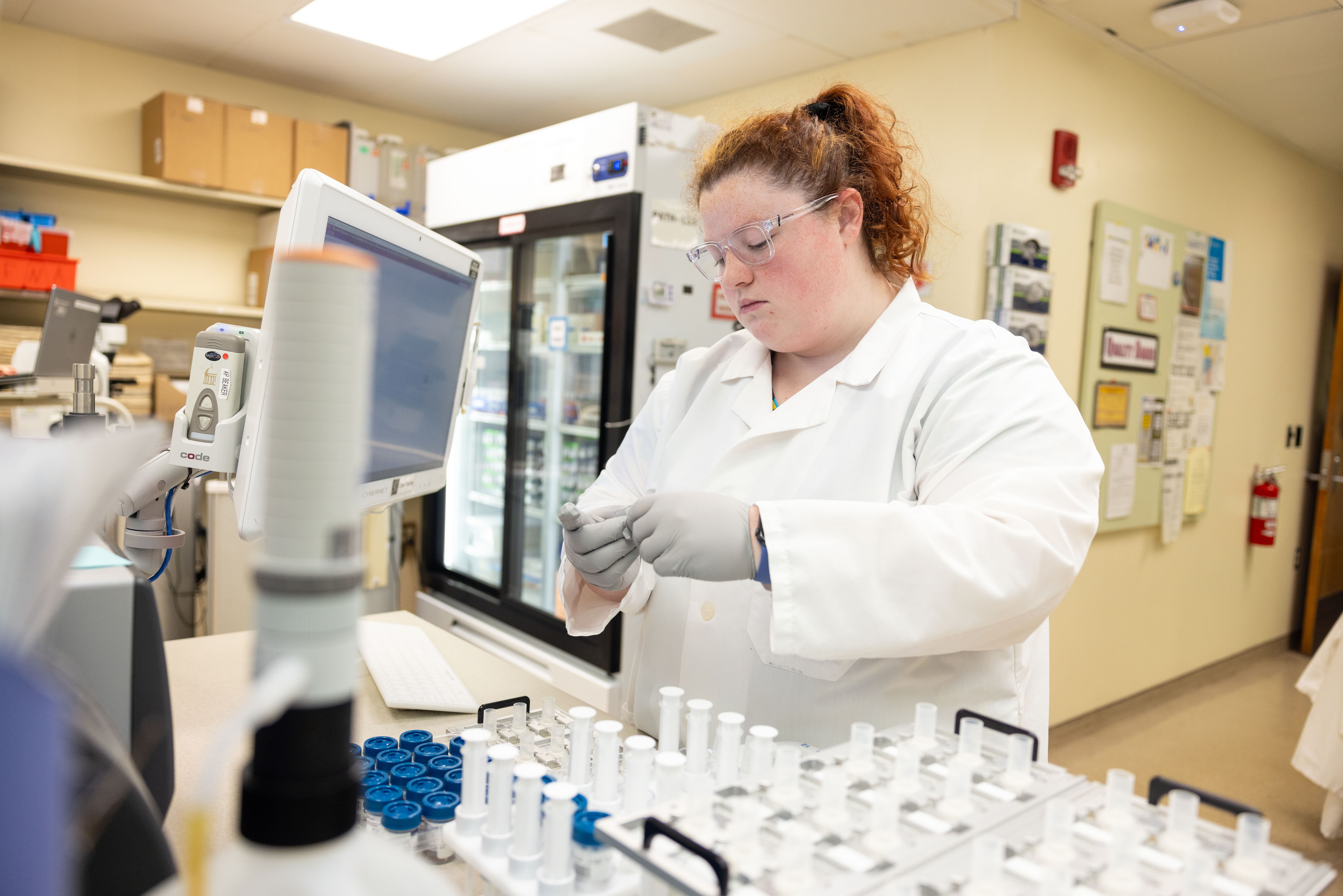 Laboratory technician prepares Pap smears for screening