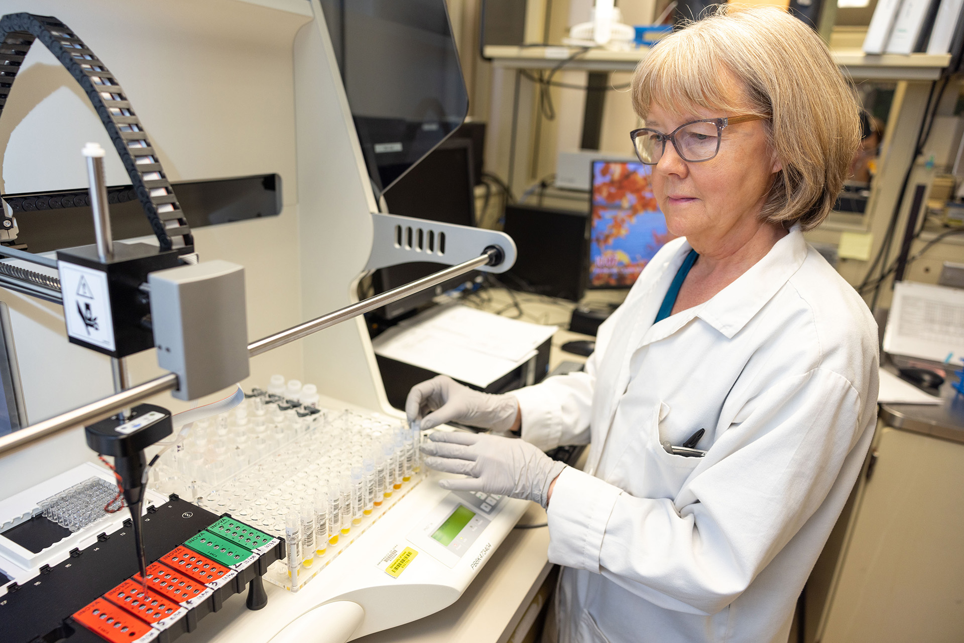 A person working with equipment in the Immunopathology lab