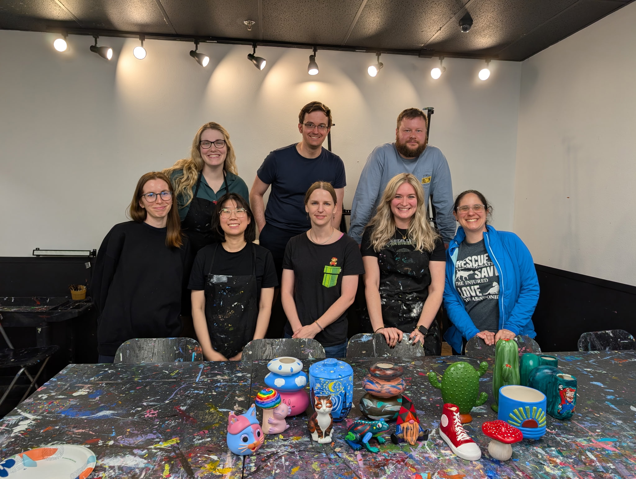 Trainees and their painted sculptures