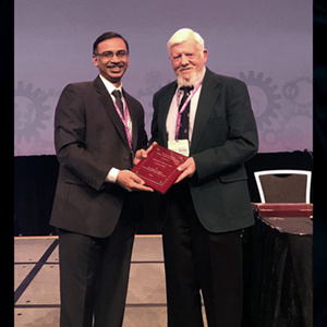 Dr. Mitros Receiving Award Dr. Mitros Receiving Award