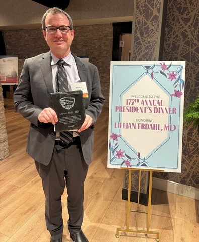 Dr. Marco Hefti receives his award as one of the Five Iowa Physicians to Watch