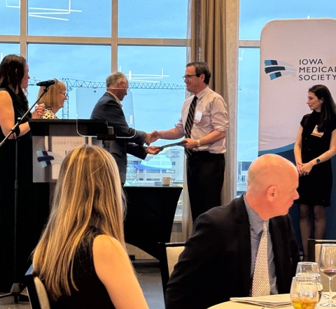 Dr. Marco Hefti receives his award as one of the Five Iowa Physicians to Watch