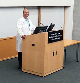 Dr. Karandikar at a podium