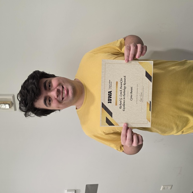 Cyrus Barati with his pathology research award