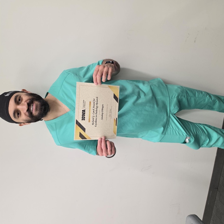 Sandeep Dhingra with his pathology research award