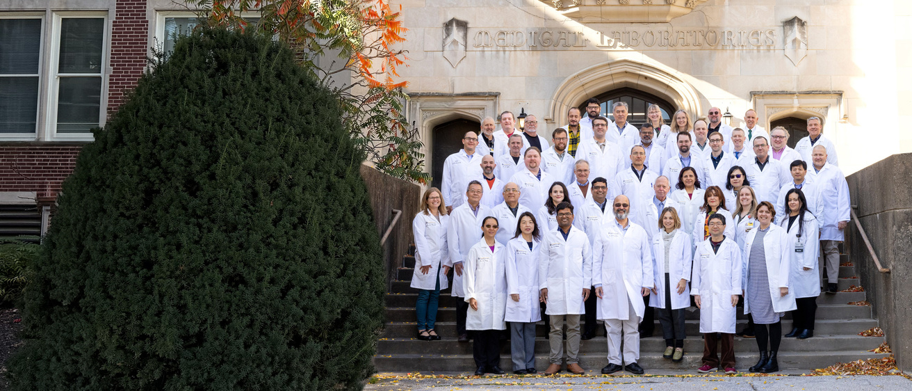 Group photo of faculty in front of the med labs