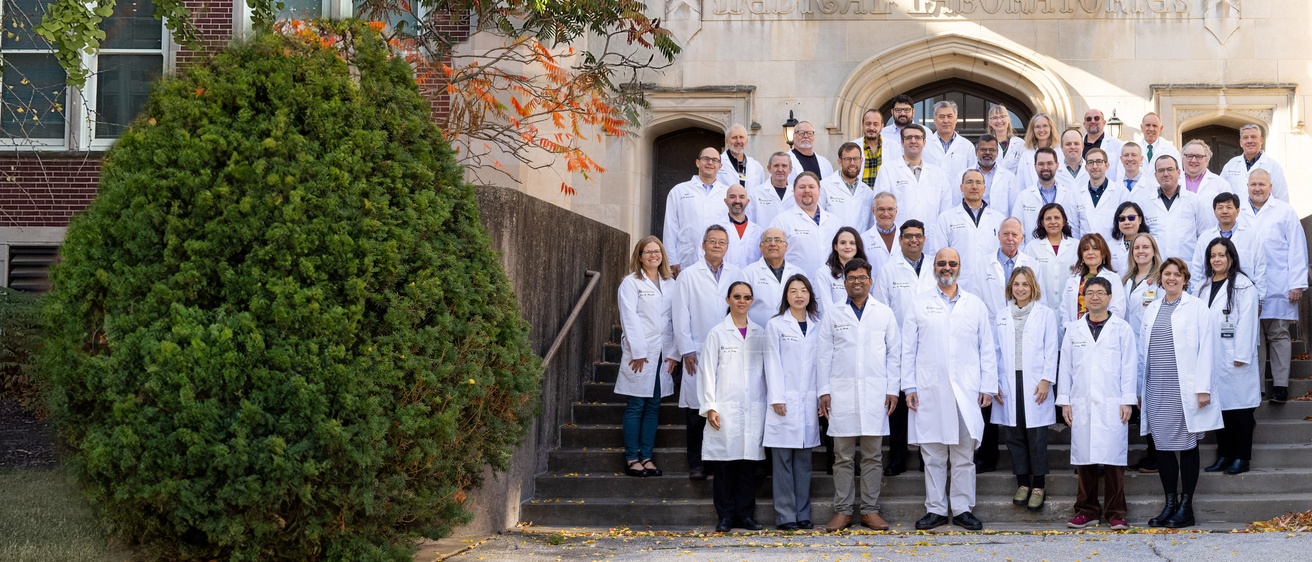 Group photo of faculty in front of the med labs