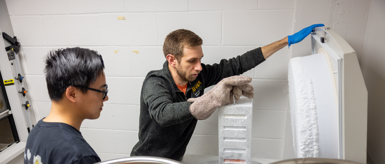 Two people handling cold samples