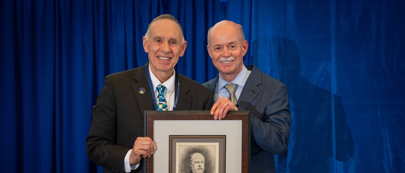 Brooks Jackson receives an award plaque