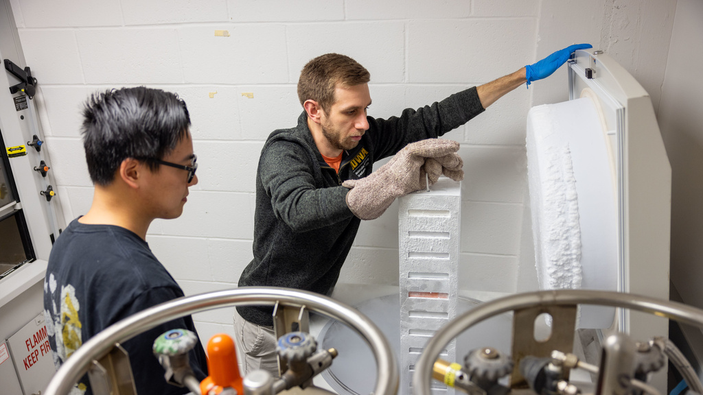 Two people handling cold samples
