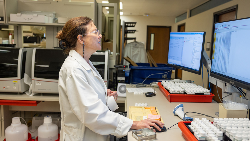 clinical lab technical specialist operates a computer
